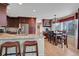 Open kitchen with granite counters, stainless steel appliances, and a bright dining area at 2649 S Kline Cir, Lakewood, CO 80227