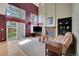 Living room with a fireplace, carpeted floors, and large windows with natural light at 2649 S Kline Cir, Lakewood, CO 80227