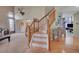 View of the home's wooden staircase, open floor plan, and hardwood flooring at 2649 S Kline Cir, Lakewood, CO 80227