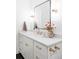 Elegant bathroom with modern vanity, stylish lighting, and chic decor at 11825 W 25Th Ave, Lakewood, CO 80215