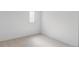 Bedroom with neutral carpet, white walls, and window at 11825 W 25Th Ave, Lakewood, CO 80215