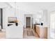 Modern kitchen featuring a large island, stainless steel appliances, and light wood cabinetry at 11825 W 25Th Ave, Lakewood, CO 80215
