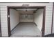 A garage with epoxy floors and built-in storage cabinets at 12033 E Harvard Ave # 208, Aurora, CO 80014