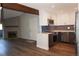 Renovated kitchen featuring stainless steel appliances, subway tile backsplash, and wood beam at 12033 E Harvard Ave # 208, Aurora, CO 80014