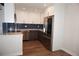 Updated kitchen with stainless steel appliances, modern cabinetry, and backsplash at 12033 E Harvard Ave # 208, Aurora, CO 80014