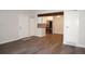 Open-concept living space featuring modern flooring and stainless steel appliances at 12033 E Harvard Ave # 208, Aurora, CO 80014
