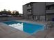 A community swimming pool with lounge chairs nearby at 12033 E Harvard Ave # 208, Aurora, CO 80014