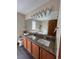 Bathroom featuring double sinks, granite countertops, and a large mirror with vanity lighting at 1062 Timbervale Trl, Highlands Ranch, CO 80129