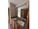 Bathroom featuring a double vanity with granite countertops and bright lighting at 1062 Timbervale Trl, Highlands Ranch, CO 80129