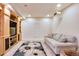 Cozy finished basement with built-in entertainment center, recessed lighting and comfortable seating at 1011 S Valentia St # 147, Denver, CO 80247