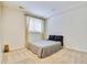 Simple bedroom design with a neutral color scheme and large windows offering plenty of natural light at 1011 S Valentia St # 147, Denver, CO 80247