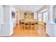 Bright dining room features hardwood floors, a large window, and elegant display cabinet at 1011 S Valentia St # 147, Denver, CO 80247