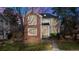 Charming brick two-story home with manicured front yard and inviting walkway at 1011 S Valentia St # 147, Denver, CO 80247