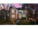 Charming red-brick two-story home with manicured front yard and walkway at 1011 S Valentia St # 147, Denver, CO 80247