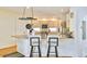 Kitchen featuring an island with bar seating, stainless steel appliances, and lots of natural light at 1011 S Valentia St # 147, Denver, CO 80247
