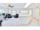 Open living area with natural light, skylight, multiple windows, and comfortable seating area at 1011 S Valentia St # 147, Denver, CO 80247