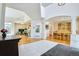 Open-concept interior with hardwood floors, featuring a dining area and a kitchen with breakfast bar at 1011 S Valentia St # 147, Denver, CO 80247