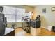 Home office with hardwood floors, a large window with natural light and an ergonomic workstation at 1011 S Valentia St # 147, Denver, CO 80247