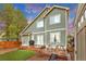 Beautiful backyard with wooden deck and manicured faux-grass for outdoor enjoyment at 4279 Brandon Ave, Broomfield, CO 80020
