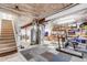 Unfinished basement with a working treadmill, storage and stairs leading to the first floor at 4279 Brandon Ave, Broomfield, CO 80020
