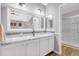 Bathroom featuring a double sink vanity, granite countertop and new light fixtures at 4279 Brandon Ave, Broomfield, CO 80020