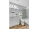 Full bathroom featuring a shower-tub combo, updated fixtures and vinyl flooring at 4279 Brandon Ave, Broomfield, CO 80020