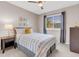 Bedroom with neutral walls, large windows and a ceiling fan at 4279 Brandon Ave, Broomfield, CO 80020