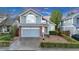 Charming two-story home featuring a manicured lawn, brick accents, and an attached two-car garage at 4279 Brandon Ave, Broomfield, CO 80020