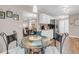 Bright kitchen featuring white cabinets, stainless steel appliances, and an adjacent dining area at 4279 Brandon Ave, Broomfield, CO 80020