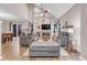 Open living room featuring high ceilings, a fireplace, and two sofas for ample seating and entertaining at 4279 Brandon Ave, Broomfield, CO 80020