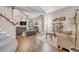Cozy living room featuring vaulted ceilings, a fireplace, hardwood floors, and comfortable seating at 4279 Brandon Ave, Broomfield, CO 80020