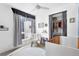 Bright Bedroom with rocking chair, closet, and natural light at 2150 S Delaware St, Denver, CO 80223
