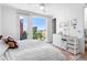 Bright bedroom with large window and a view of the city at 2150 S Delaware St, Denver, CO 80223