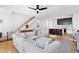 Open-concept living space with modern furniture and hardwood flooring at 2150 S Delaware St, Denver, CO 80223