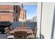 Rooftop patio dining area with grill and city views at 2150 S Delaware St, Denver, CO 80223