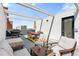 Spacious rooftop patio with dining and seating area at 2150 S Delaware St, Denver, CO 80223