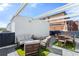 Relax on this rooftop patio, complete with dining and seating areas, and a grill at 2150 S Delaware St, Denver, CO 80223