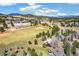 Community aerial view features nearby recreation fields and stunning mountain views in the distance at 1927 Sunset Cir, Evergreen, CO 80439