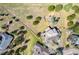 Expansive aerial view showcases the home's generous lot, mature trees, and privacy fencing at 1927 Sunset Cir, Evergreen, CO 80439