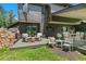 Inviting back deck with outdoor seating, grill area, and string lights for evening enjoyment at 1927 Sunset Cir, Evergreen, CO 80439