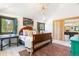Bright bedroom features vaulted ceilings, wood-framed windows, and access to an en-suite bathroom with stylish finishes at 1927 Sunset Cir, Evergreen, CO 80439