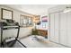 Bright bedroom with a desk, closet, and exercise equipment, creating a functional living space at 1927 Sunset Cir, Evergreen, CO 80439