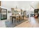 Open concept dining and kitchen area with gray cabinets and seating for six at 1927 Sunset Cir, Evergreen, CO 80439