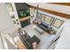 Bright living room with fireplace, wood beams, neutral rug and comfortable seating creating a welcoming atmosphere at 1927 Sunset Cir, Evergreen, CO 80439