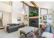 Vaulted ceiling living room featuring a fireplace, decor and comfortable sofas at 1927 Sunset Cir, Evergreen, CO 80439