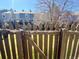 Fenced backyard with grass, landscaping, and views of the surrounding neighborhood at 10561 W Dartmouth Ave, Lakewood, CO 80227