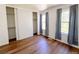 Spacious bedroom features sleek wood floors, closet, and plenty of natural light at 10561 W Dartmouth Ave, Lakewood, CO 80227