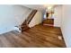 Bright living room featuring hardwood floors and staircase to the upper level at 10561 W Dartmouth Ave, Lakewood, CO 80227