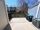 Outdoor patio space with hardscape, privacy fence, and AC unit at 10561 W Dartmouth Ave, Lakewood, CO 80227