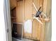 A cluttered storage area with exposed studs is shown at 10561 W Dartmouth Ave, Lakewood, CO 80227
